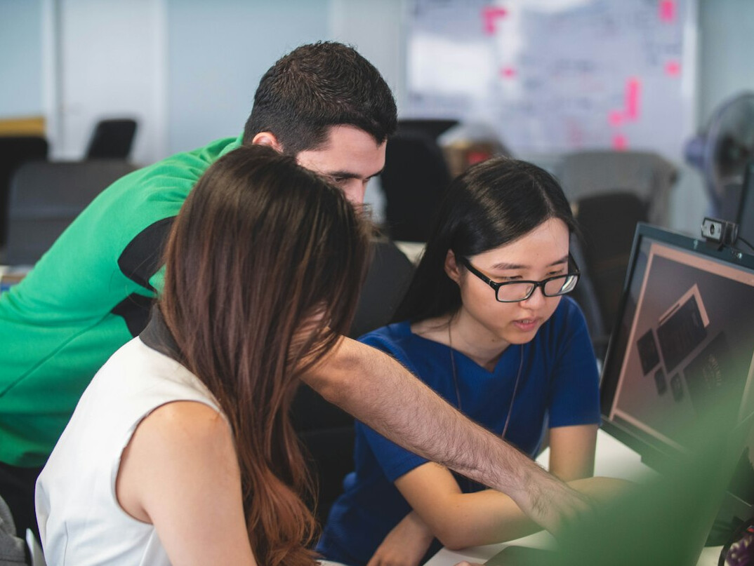 group of coders collaborating