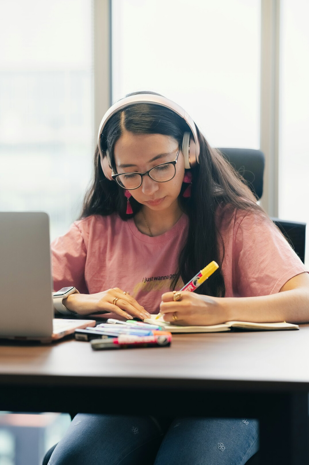 japanese student coding on laptop